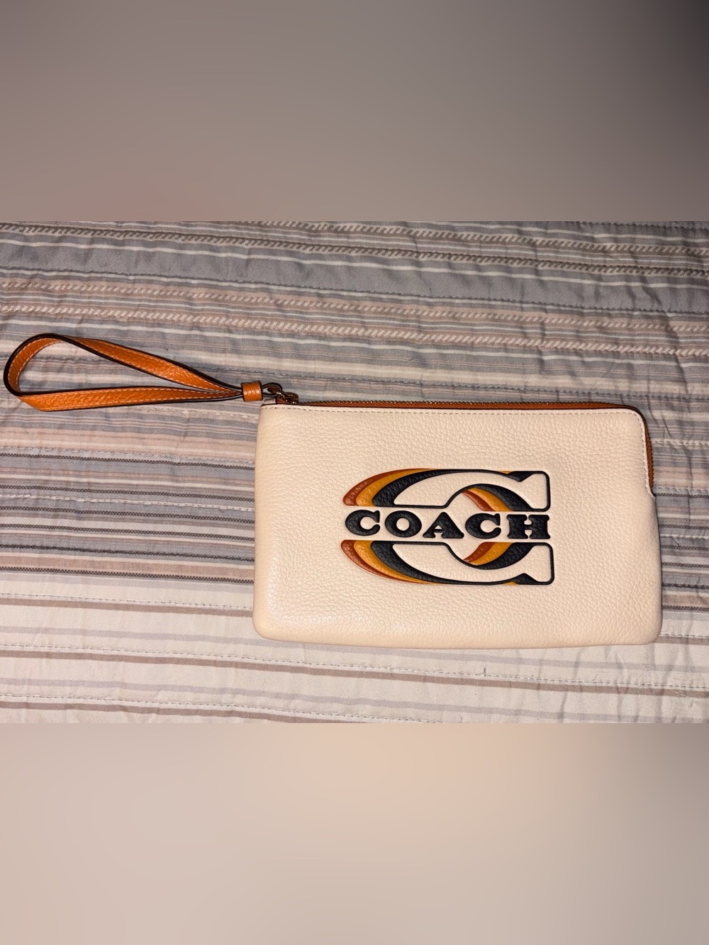 Coach Cream Pebbled Leather Wristlet with Multicolor Logo